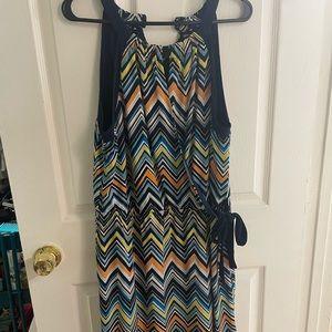 Women’s dress. Has wrap tie that flatters the waist and halter neck.